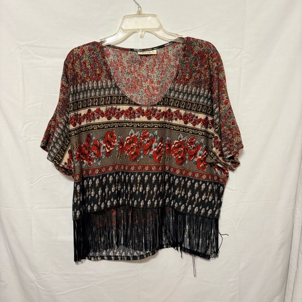 Belle du Tour boho fringe cropped top featuring a floral and ethnic pattern